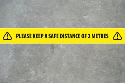 image of Social Distance Tape applied to a concrete floor